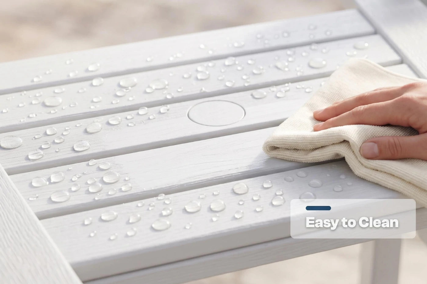 Person cleaning a white outdoor table with water droplets using a cloth, with 'Easy to Clean' text overlay.