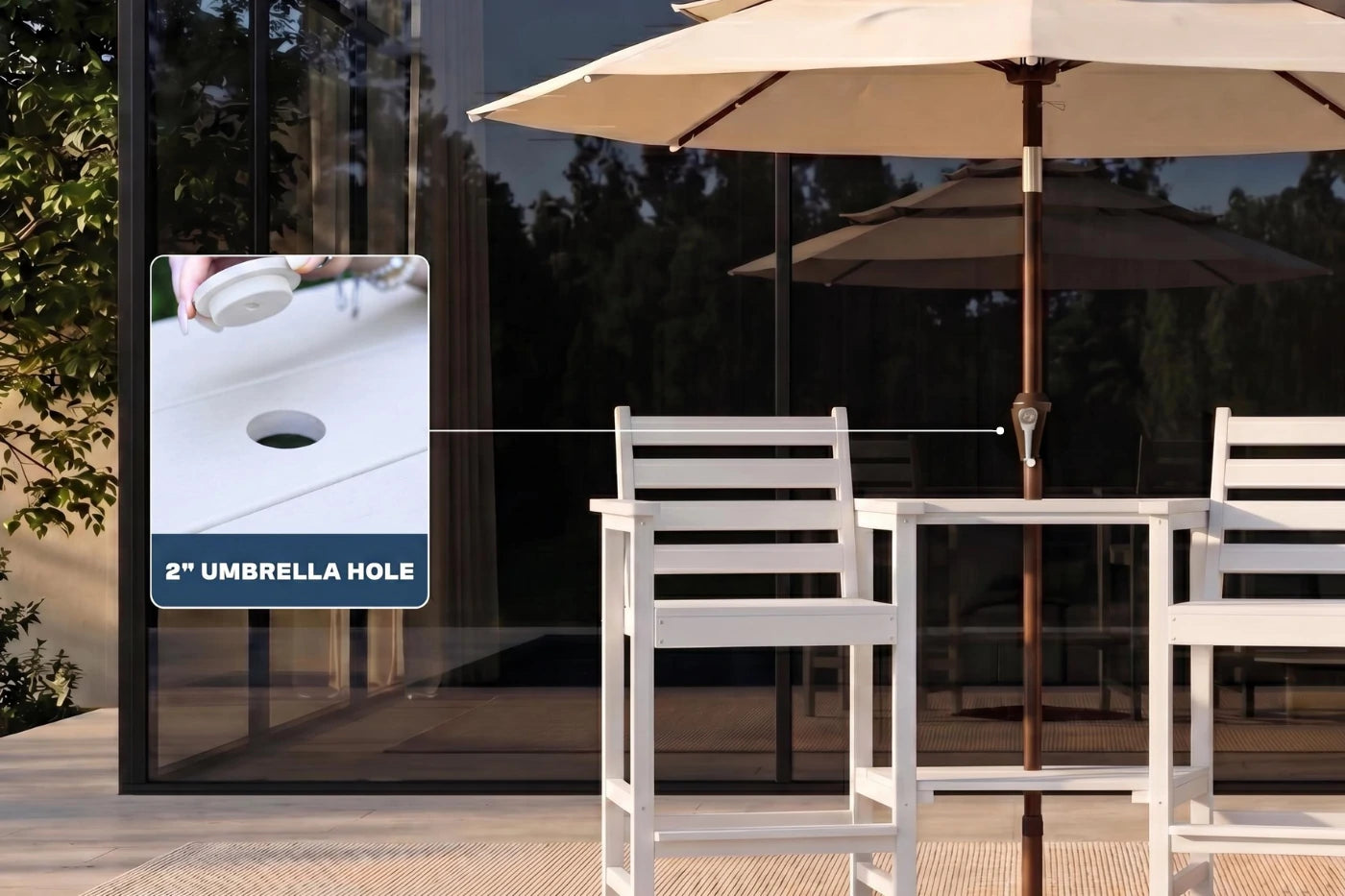 Outdoor furniture set with a table and chairs, featuring an umbrella hole on a glass wall.