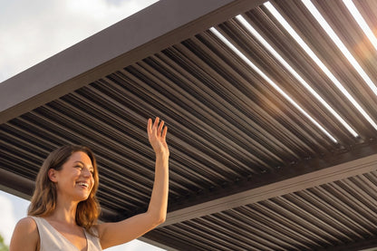Woman waving under a retractable roof