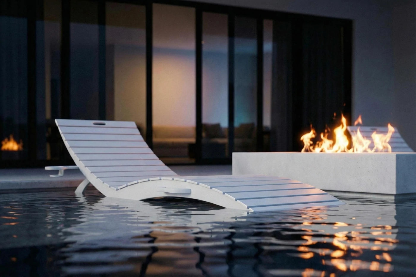Modern lounge chair by a fire pit with water reflection
