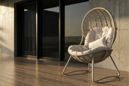 Wicker chair with cushions on a wooden deck