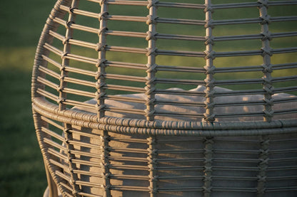 Close-up of a wicker basket with a blurred green background