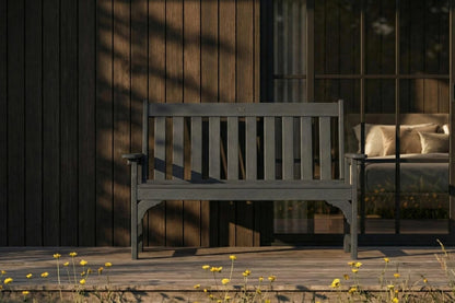 Wooden bench on a wooden deck with a blurred background