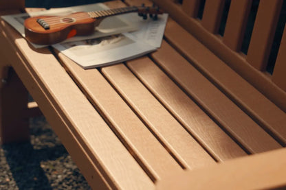 Wooden bench with a ukulele and magazine on top