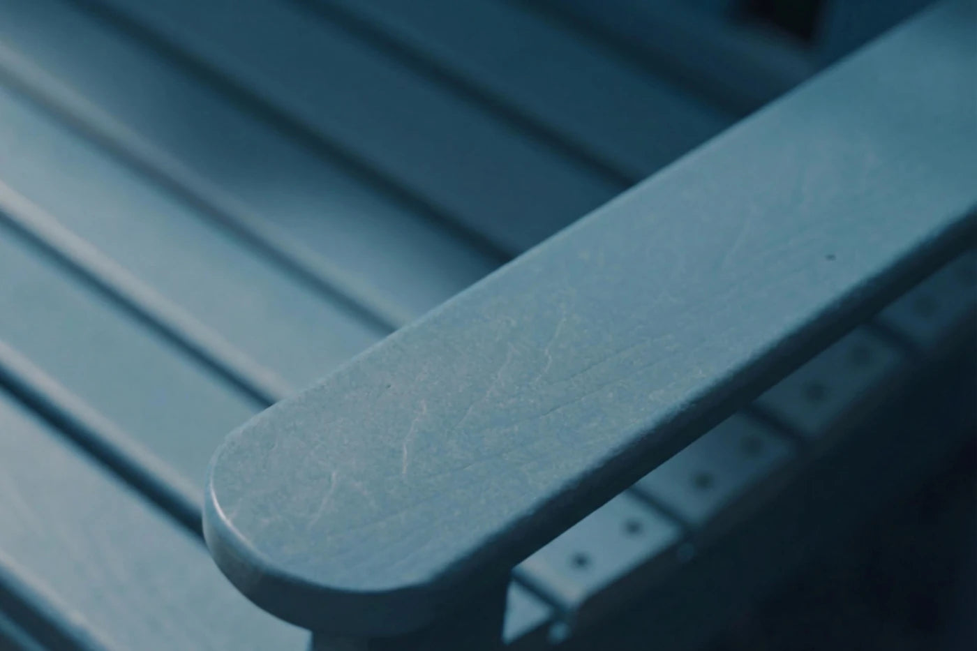 Close-up of a blue metal surface with visible texture