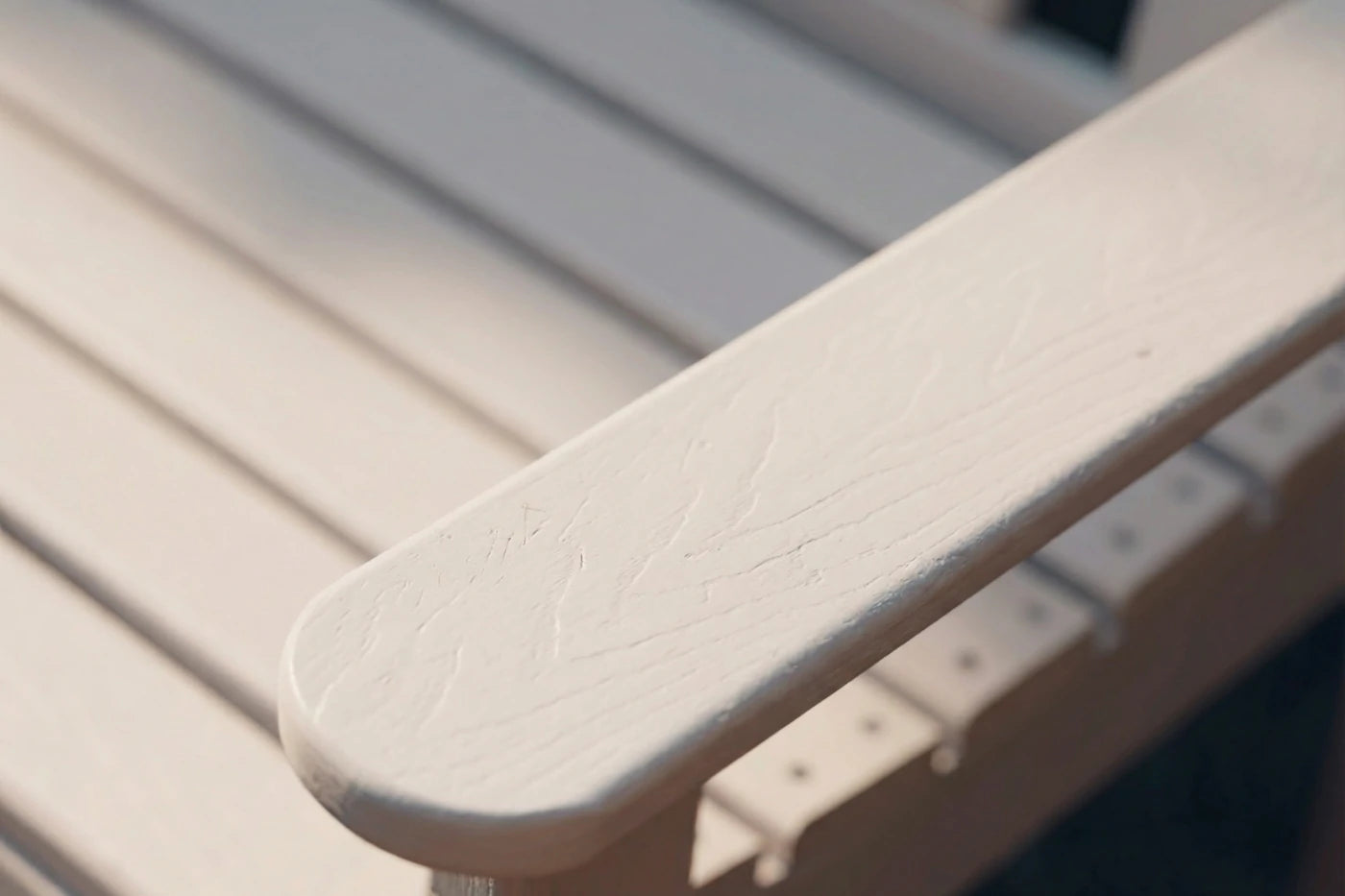 Close-up of a beige plastic chair with a blurred background