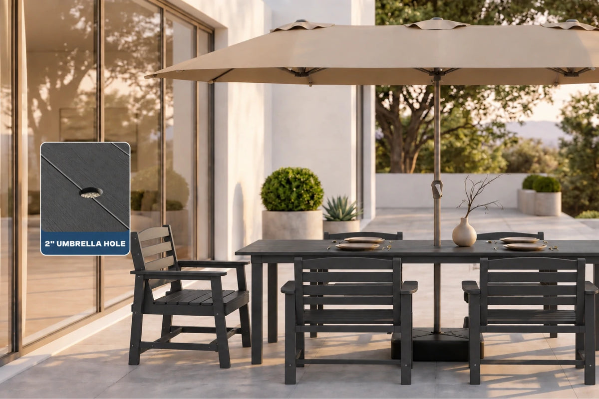 Outdoor patio dining set with a dark gray table and chairs under a beige patio umbrella, with a blue inset graphic labeled '2" UMBRELLA HOLE' showing the mounting feature.