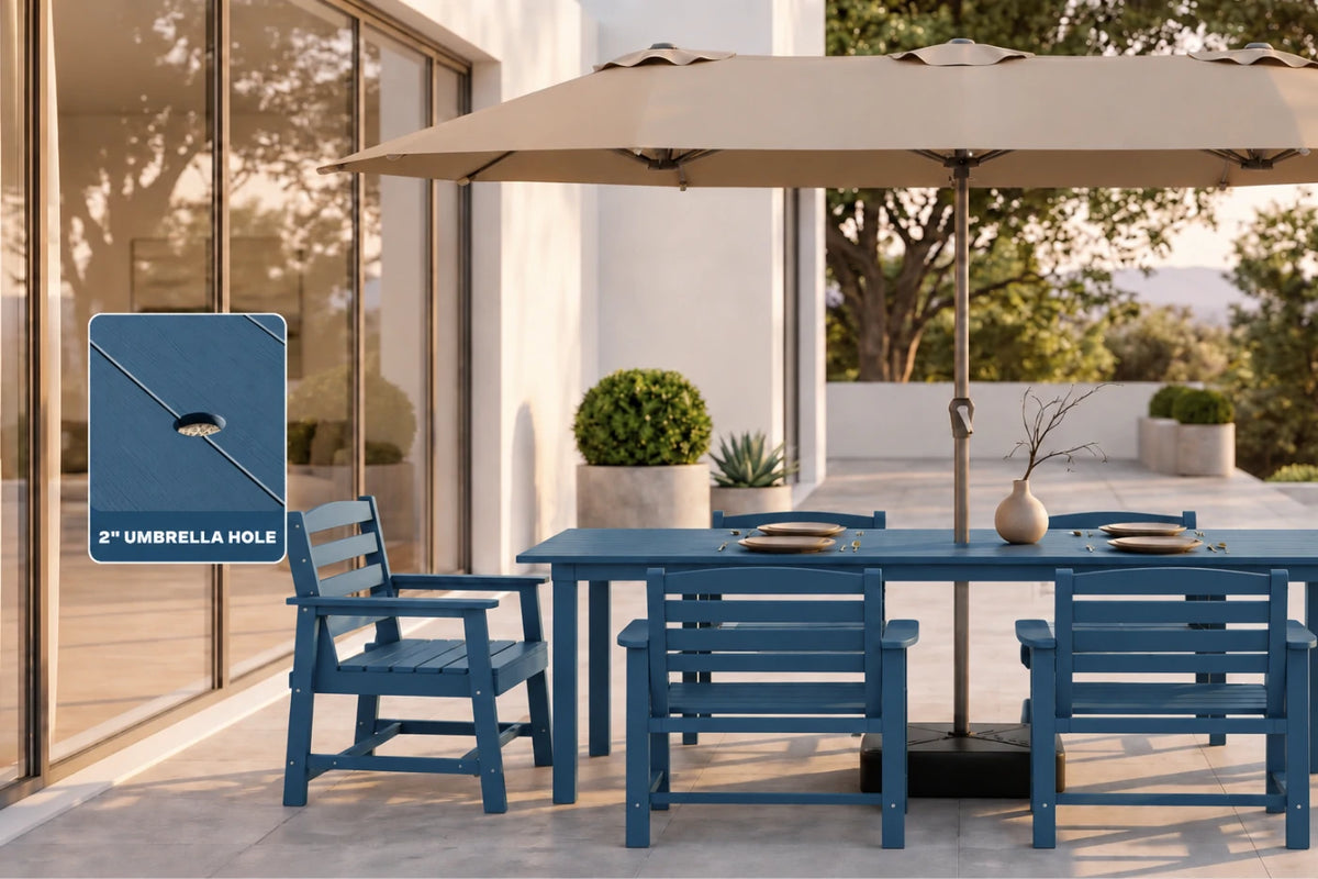 Outdoor patio dining set with a blue table and chairs under a large beige umbrella, shown on a modern patio with a glass door and potted plants. A blue inset graphic on the left highlights the umbrella hole for depth perception.