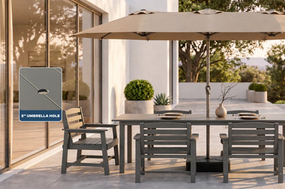 Outdoor patio dining set with a gray wooden table and 5 matching chairs under a beige patio umbrella, beside a glass sliding door. A callout inset on the left highlights a 2-inch umbrella hole on the umbrella frame.