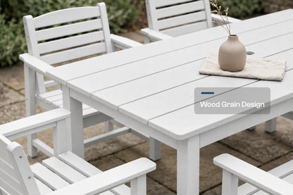 White outdoor dining table and matching chairs on a stone patio, with a small beige vase on the table and a label reading 'Wood Grain Design' overlaid near the bottom right.