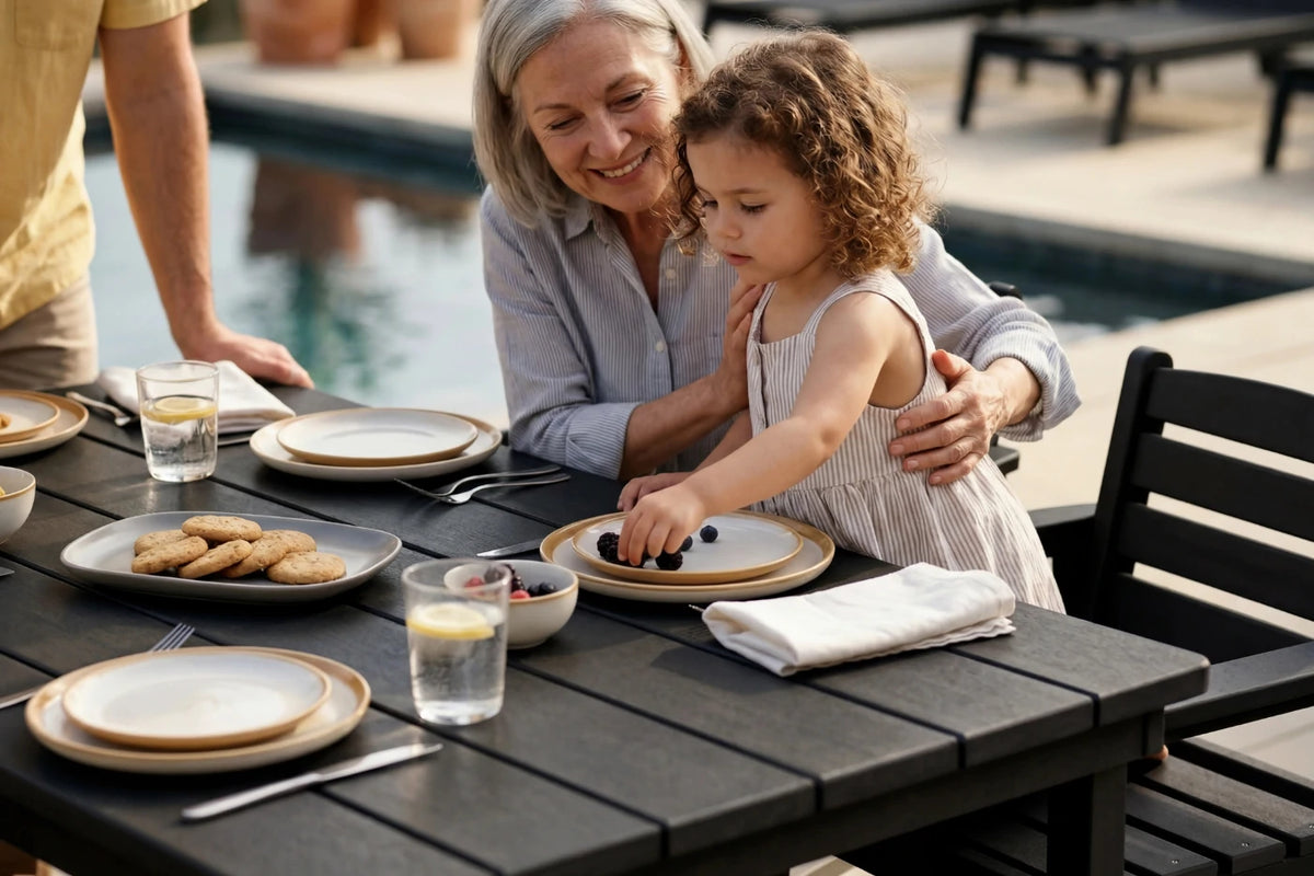 Woman and child at a dining table by a poolside