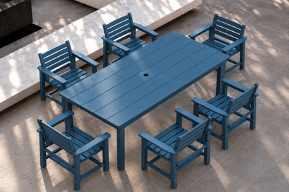 A blue outdoor dining set consisting of a rectangular slatted table and six matching armchairs, shown on a paved patio with natural dappled shadows.