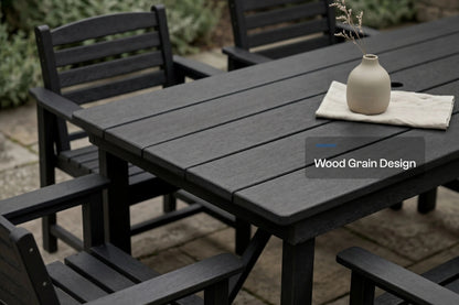 Outdoor furniture set with a black wooden table and chairs on a patio.