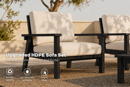 Outdoor patio furniture set featuring two black HDPE armchairs with cream-colored cushions, shown on a woven rug with a stone wall and tree in the background. Text overlays highlight the 'Upgraded HDPE Sofa Set' and feature icons for sustainability, all-weather material, and easy clean.