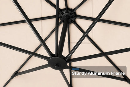 Close-up of a black aluminum umbrella frame with radiating ribs and a central hub, shown against a beige background. A text overlay reads 'Sturdy Aluminum Frame'.