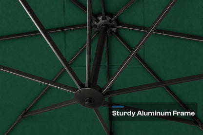 Close-up of a dark green patio umbrella canopy showing the black aluminum frame ribs radiating from the center, with a text overlay that reads 'Sturdy Aluminum Frame'.
