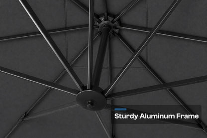 Close-up of the underside of a patio umbrella showing the dark gray canopy fabric and black aluminum frame ribs, with a text overlay that reads 'Sturdy Aluminum Frame'.