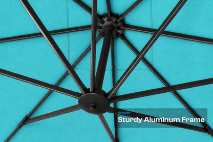 Close-up of the underside of a large patio umbrella showing a black aluminum canopy frame and ribs against a turquoise fabric surface, with the text 'Sturdy Aluminum Frame' in the lower right.