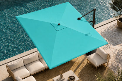 A large patio umbrella in a turquoise color, positioned over a modern outdoor lounge set next to a swimming pool.