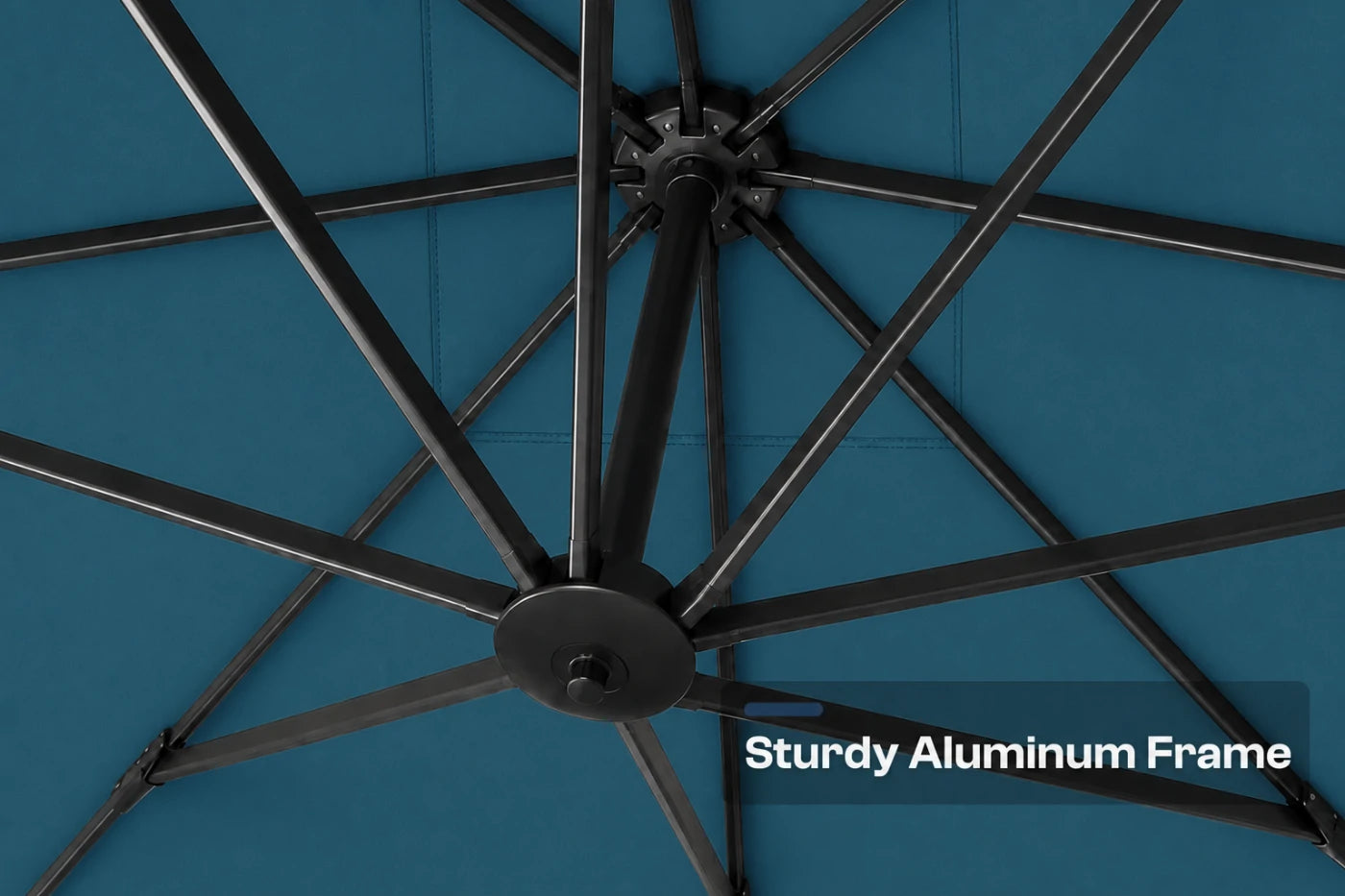 Close-up of a patio umbrella canopy and frame, showing a lake blue fabric canopy with a sturdy black aluminum support frame. A text overlay in the bottom right corner reads 'Sturdy Aluminum Frame'.